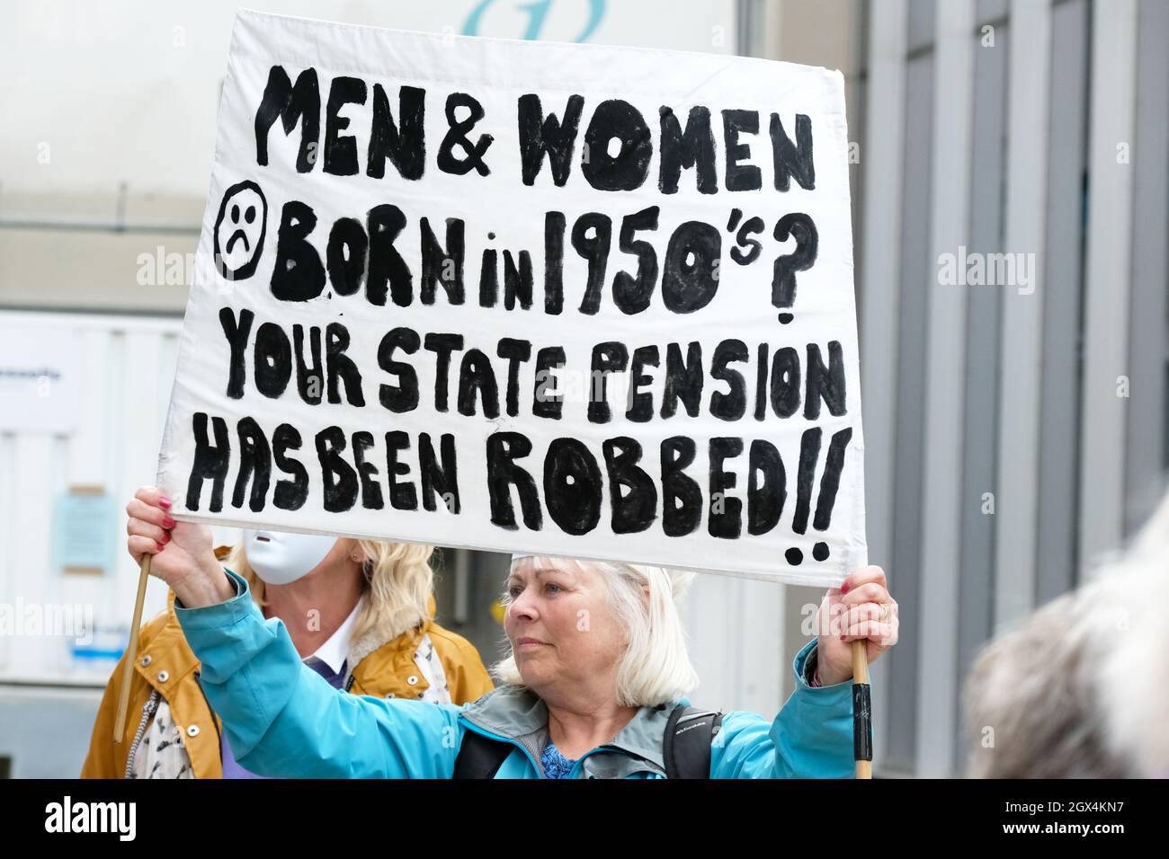 Manchester, UK – Monday 4th October 2021 – Women Against State Pension Injustice - WASPI women  protest outside the Conservative Party Conference in central Manchester against the rise in womens pension age. Photo Steven May / Alamy Live News Stock Photo