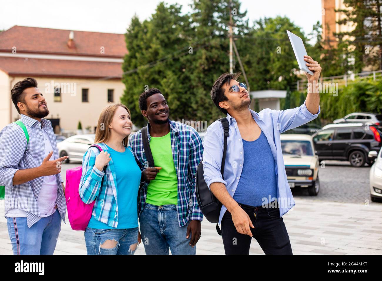The joyful group of multiethnic students taking a selfie outdoors Stock ...