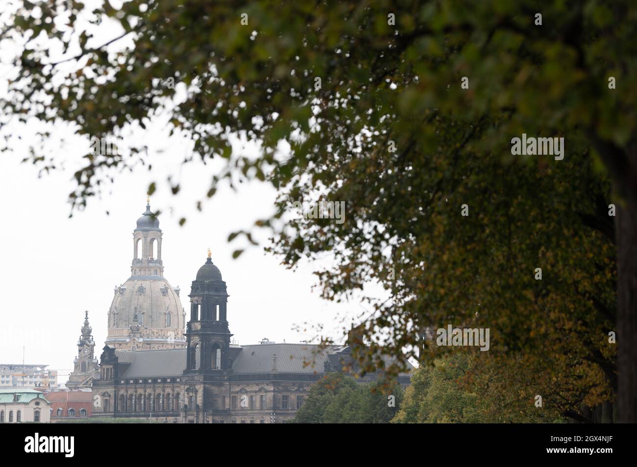 Dresden, Germany. 04th Oct, 2021. The Frauenkirche is framed by autumn ...
