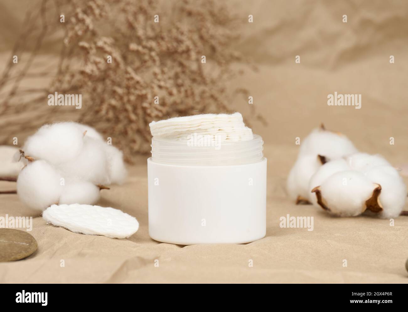 White cotton sponges on brown background. Design for the beauty, medicine and cosmetics industry Stock Photo