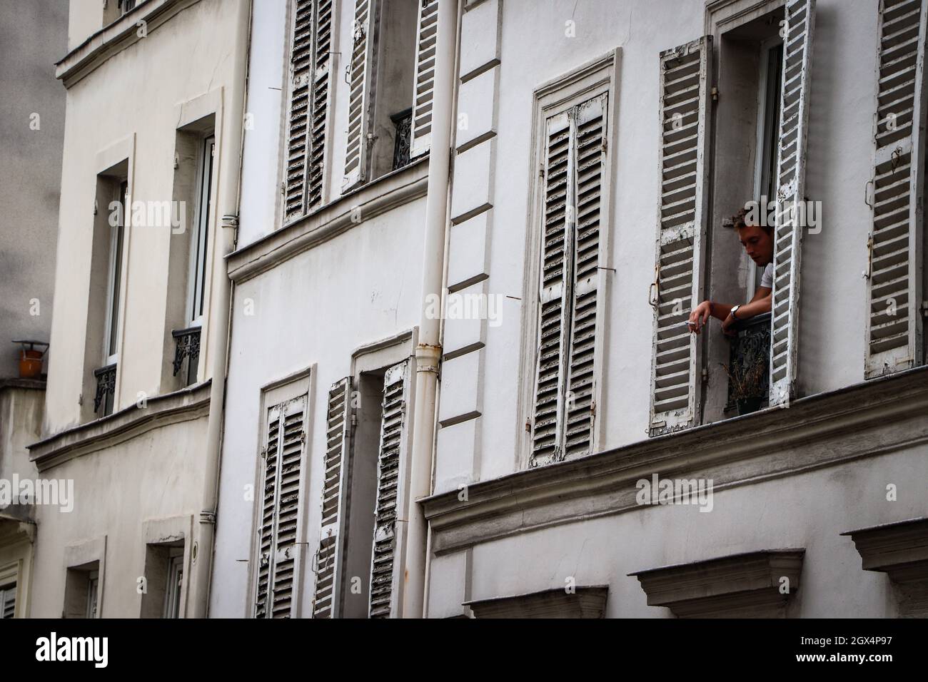 Man smoking out the window in Montmartre, Paris, France Stock Photo Alamy