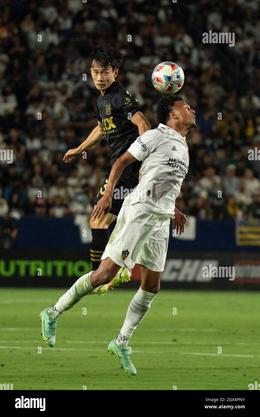 Los Angeles FC defender Kim Moon-Hwan (33) wins a header against Los Angeles Galaxy midfielder Oniel Fisher (91) during a MLS match, Sunday, Oct. 3, 2 Stock Photo