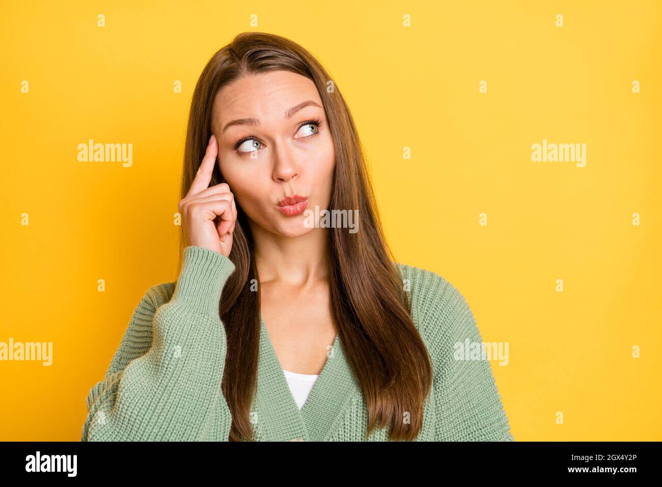 Young woman temples finger hi-res stock photography and images - Alamy