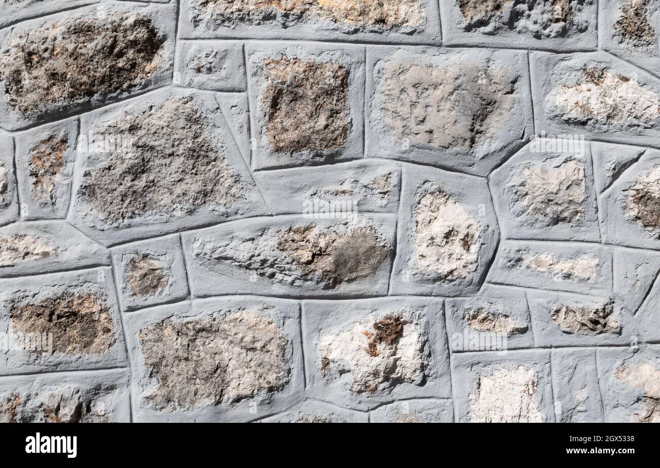 Gray rough stone cemented wall texture background. Stock Photo