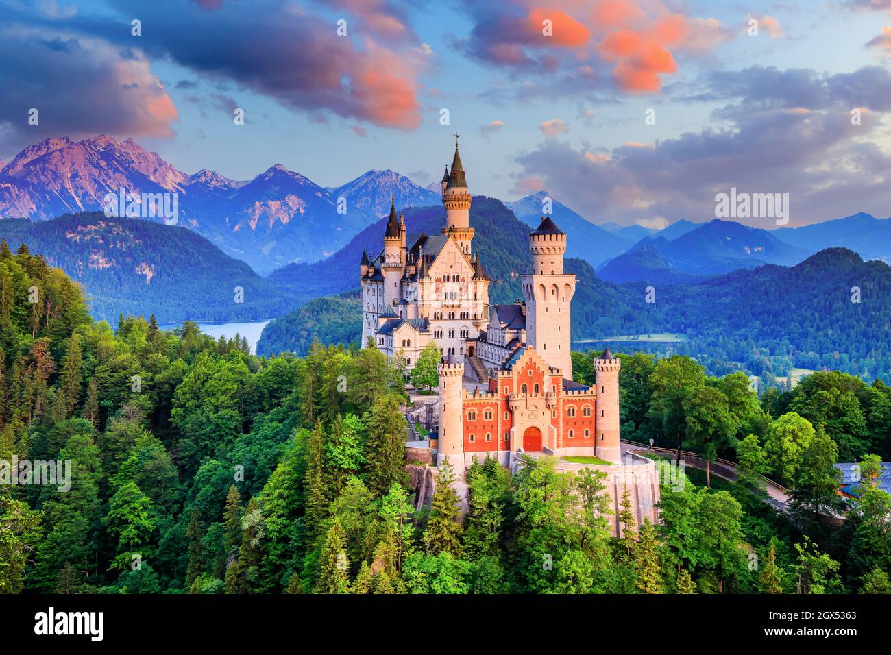 Neuschwanstein Castle, Germany. Front view of the castle and the Bavarian Alps at sunrise. Stock Photo