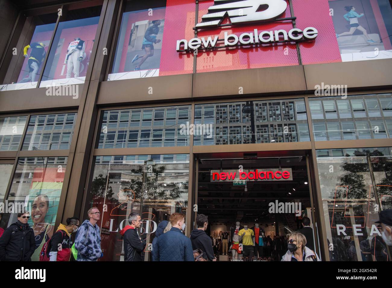 London UK 4 October 2021 Long queues formed outside New Balance store in Oxford  street ,were they were offering to engrave winners medals of the London  marathon runners ,with their names and