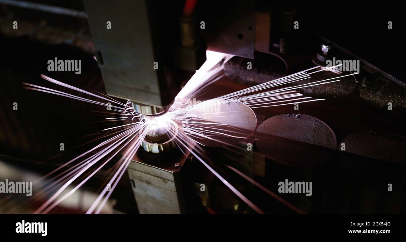 Laser machine cutting sheet metal at factory closeup Stock Photo