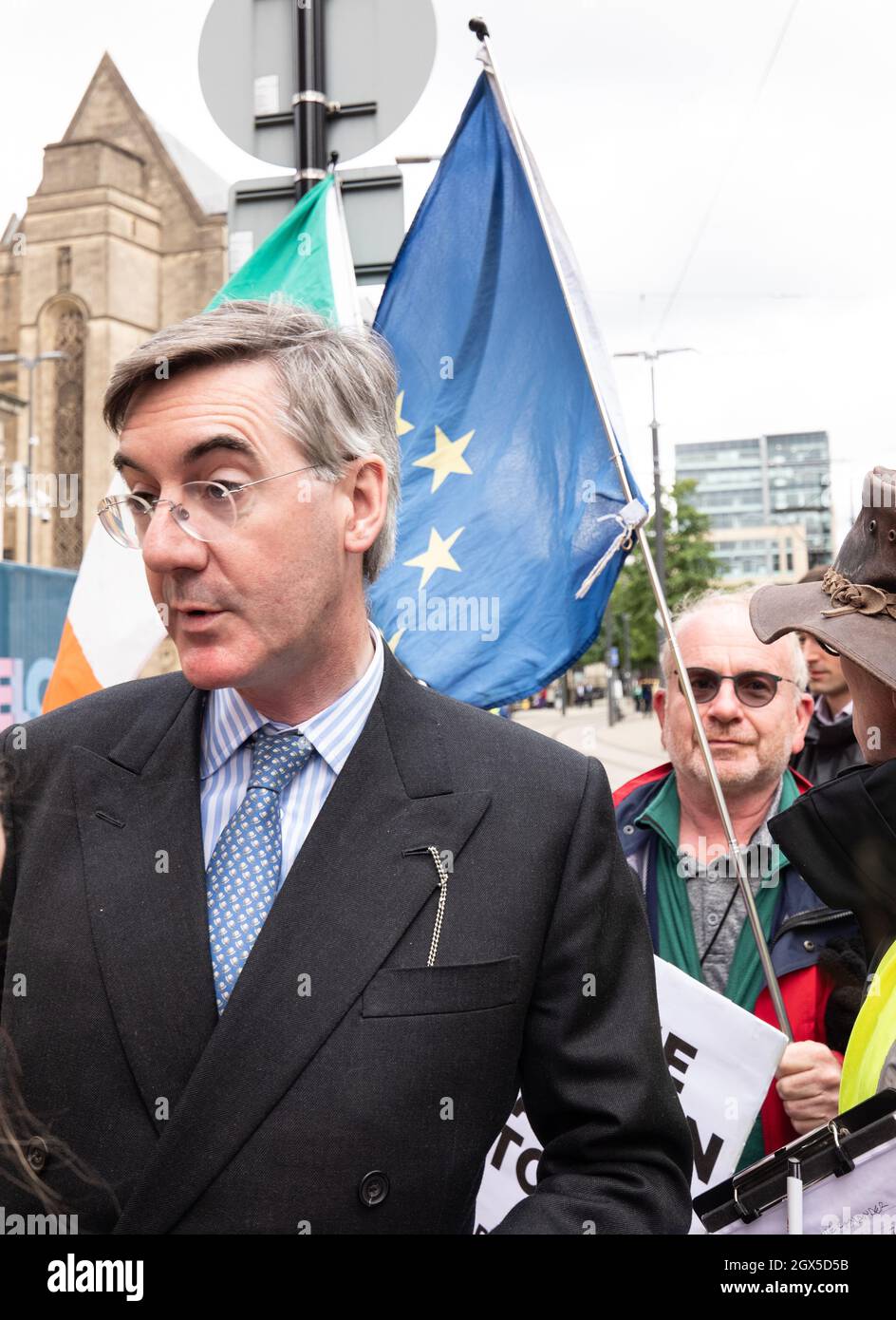 Manchester, UK. 04th Oct, 2021. Jacob Rees-Mogg takes a wrong turn out of Midland hotel and is confronted by anti government protestors where he is handed and accepts a copy of the new statesman. Manchester St Peters sq. Manchester UK. Credit: Gary Roberts/Alamy Live News Stock Photo