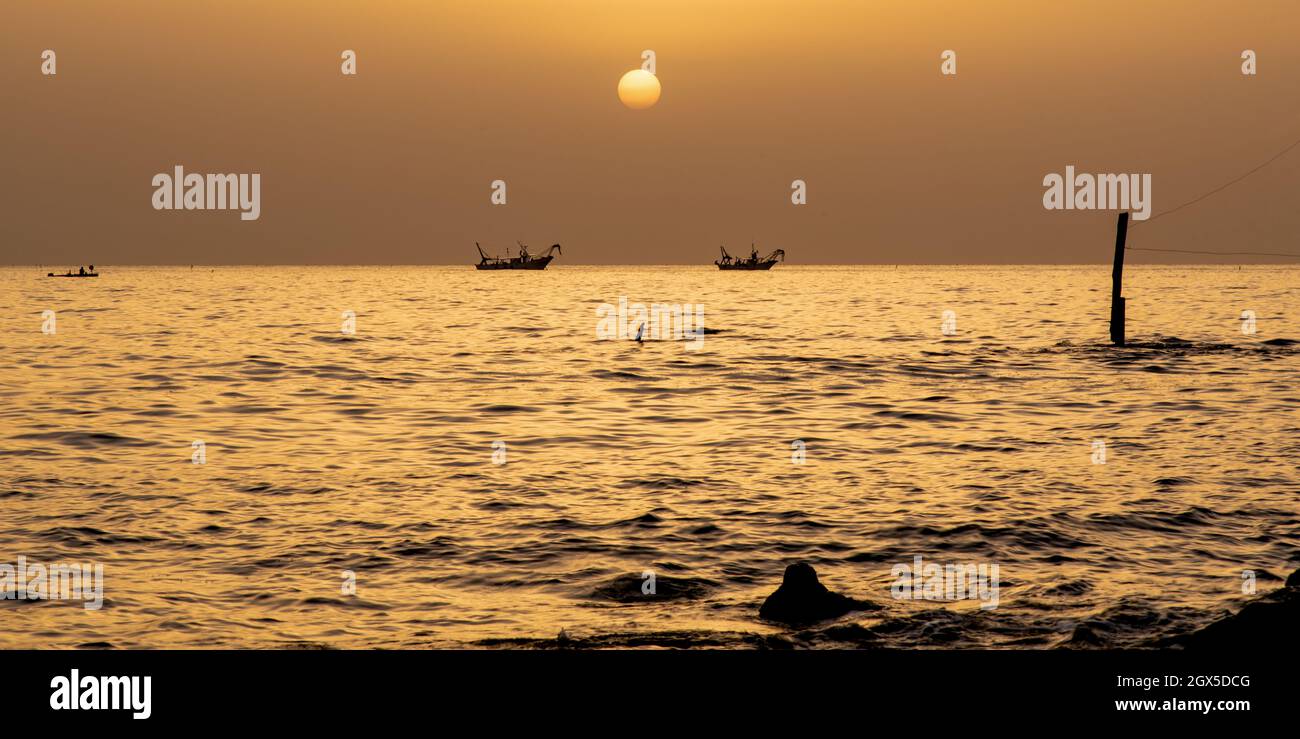 June 2021, San Vito Chietino, Abruzzo, Italy. Trabocchi coast. Fishing boats return to port at dawn. Stock Photo