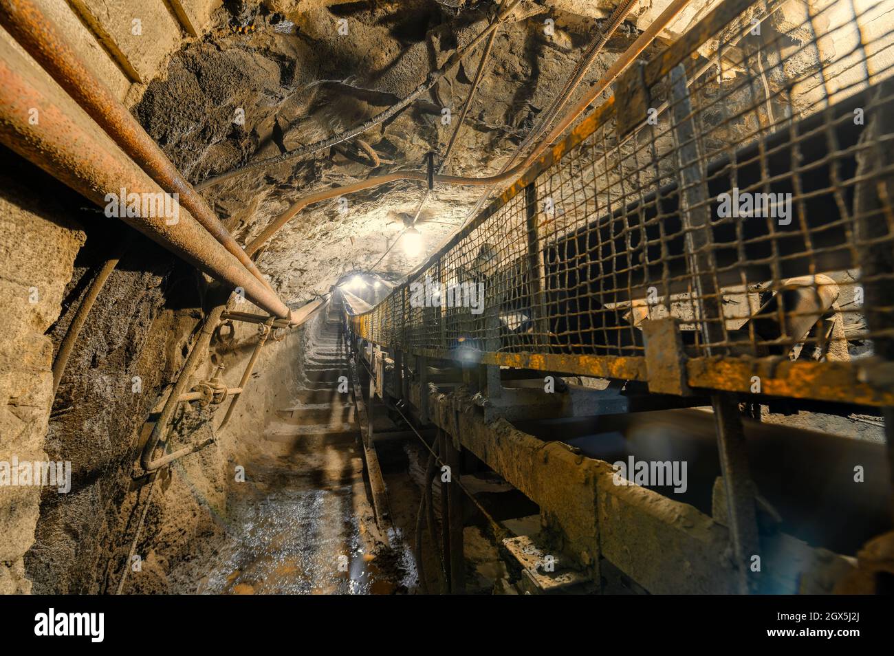 Underground belt conveyor for transporting ore to the surface Stock Photo