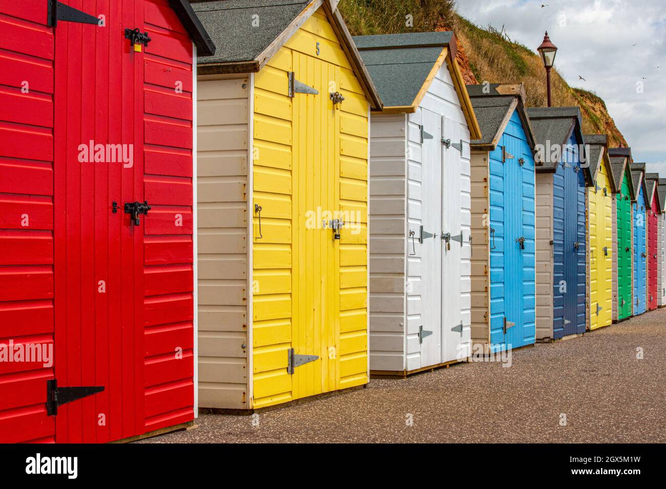 A row of beach huts on the Dorset coast of England. Stock Photo