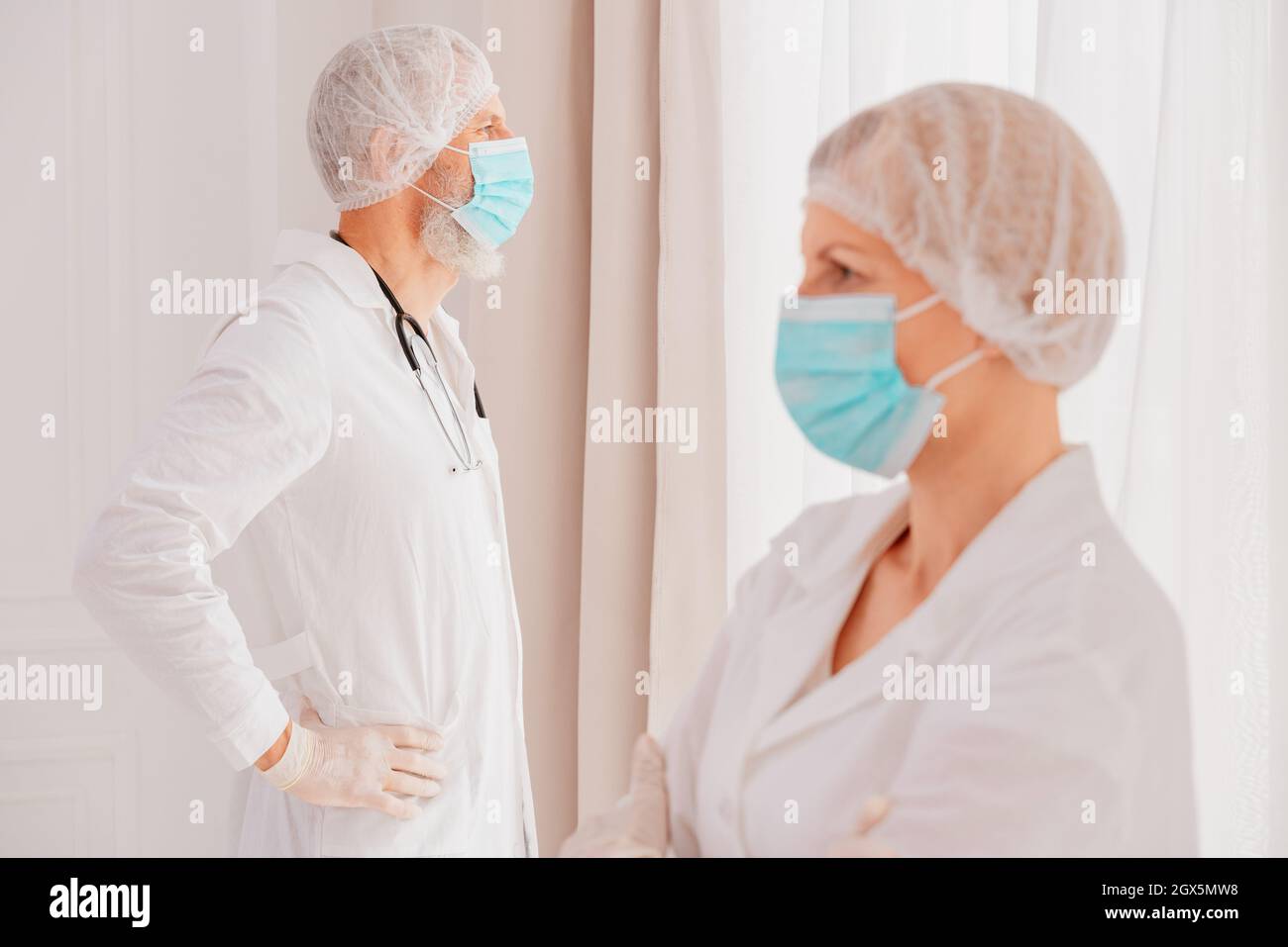 doctors with face mask think are ready to work Stock Photo