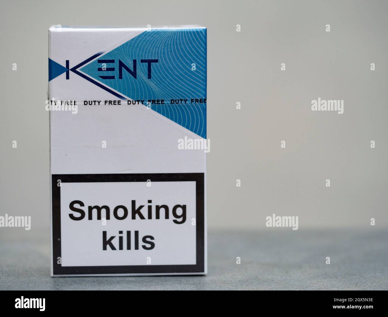 In this photo illustration, a pack of Kent Blue Cigarettes, made by British American Tobacco with a government warning 'Smoking Kills' seen displayed. Stock Photo