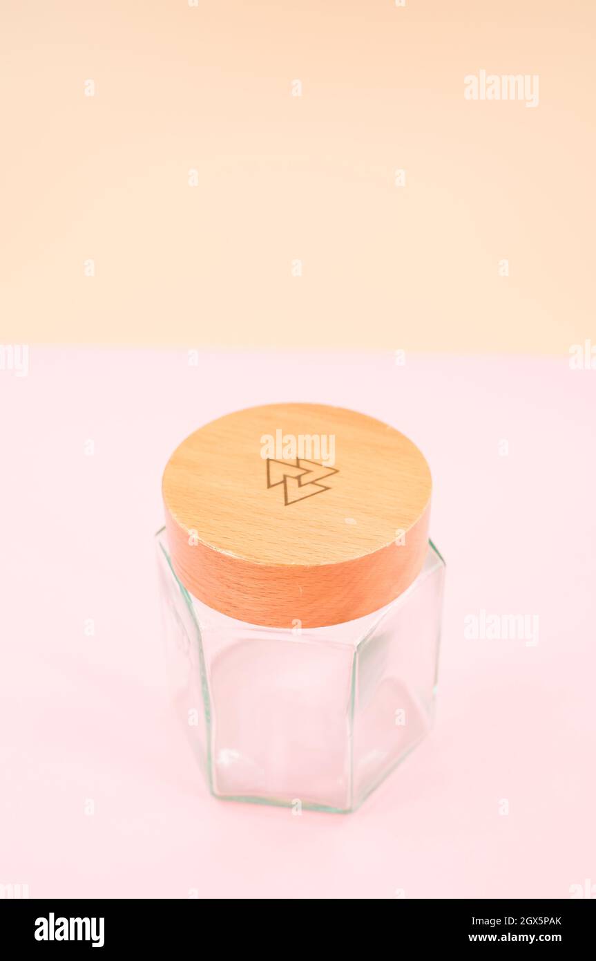 Empty glass jar with a wooden lid isolated on a pink background Stock ...