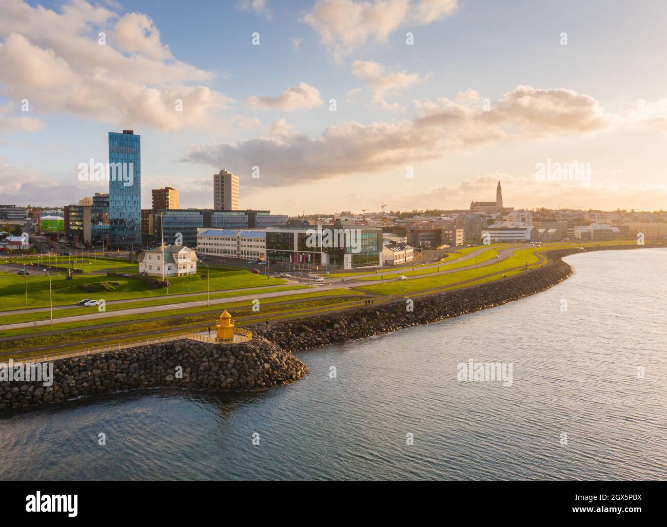 Lighthouse and Reykjavik city in the afternoon sun. Stock Photo