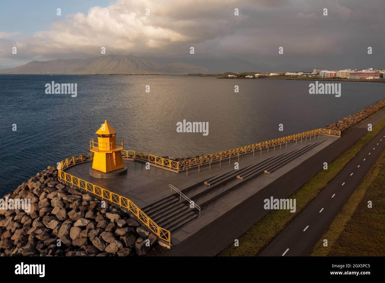 Lighthouse and Reykjavik city in the afternoon sun. Stock Photo