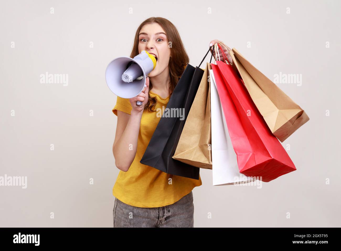 woman in casual clothing with shopping bags Stock Photo by