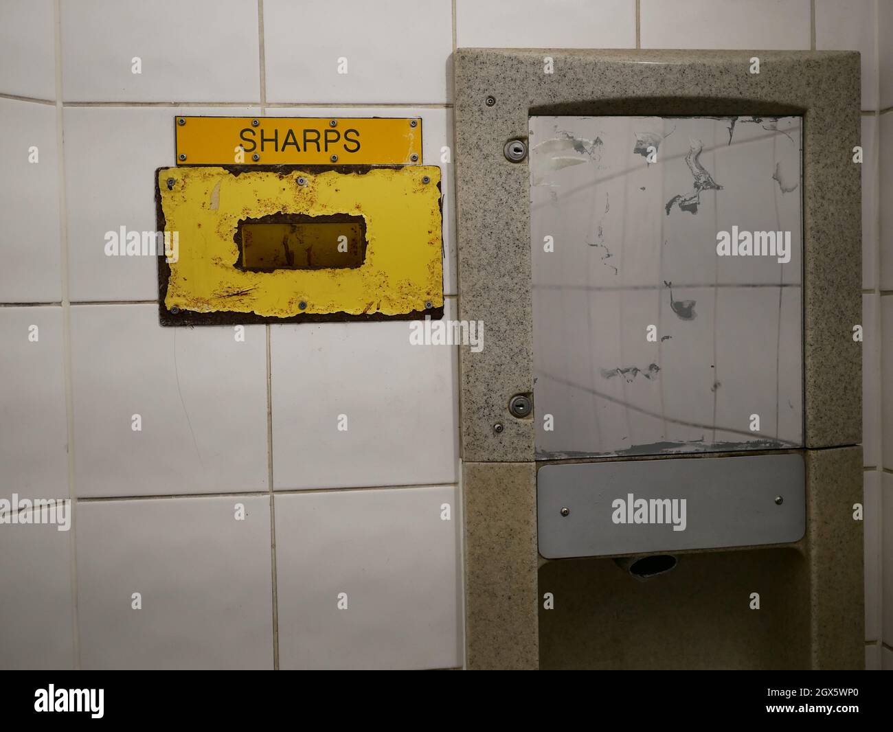 Sharps needle disposal bin in public toilet Stock Photo Alamy