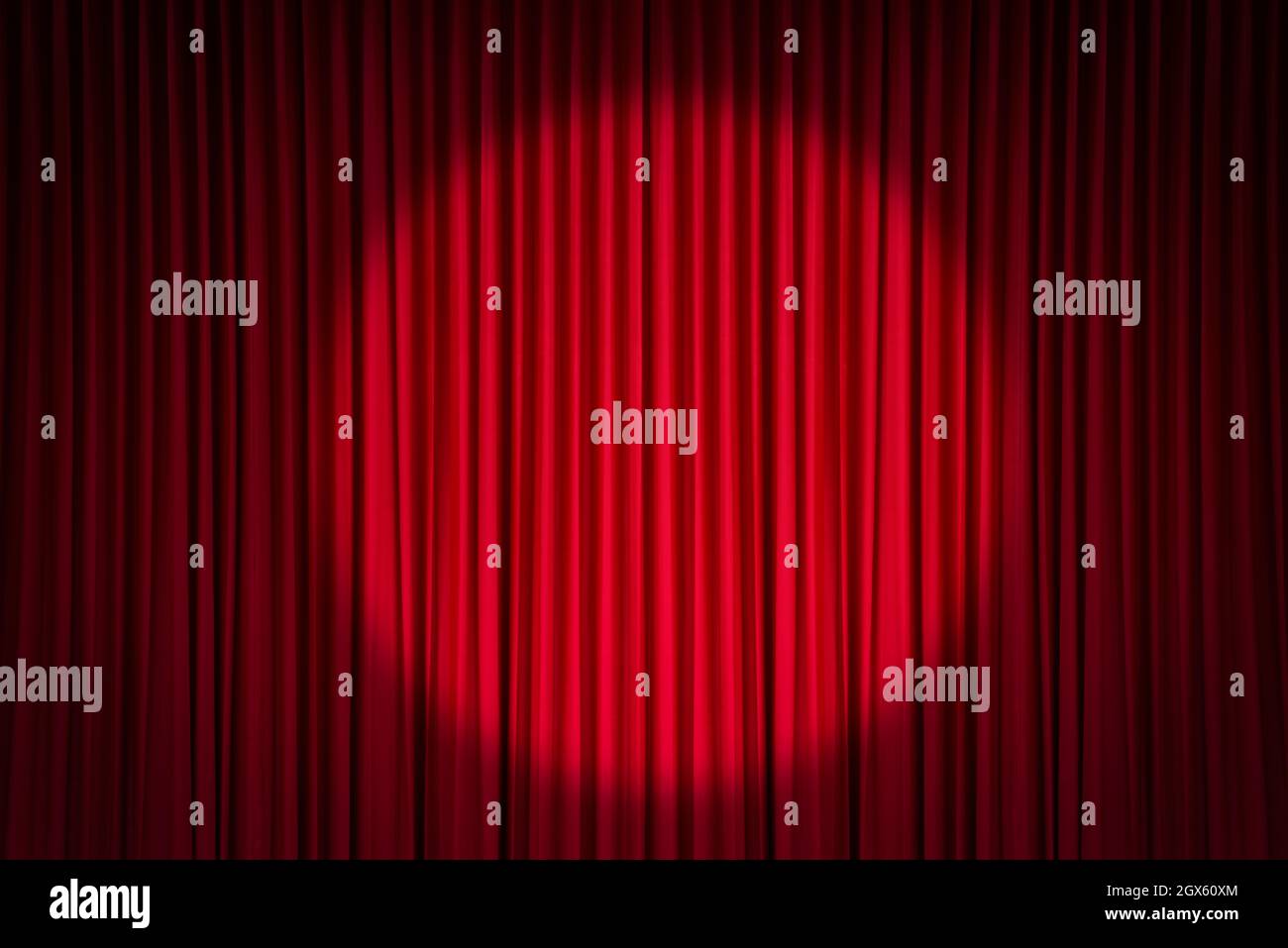 Red stage curtain with spotlight Stock Photo
