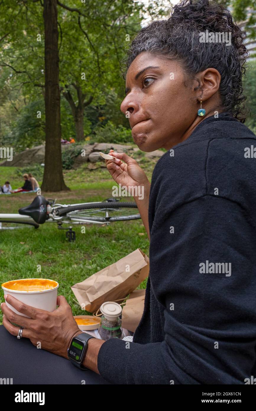 New York, United States. 03rd Oct, 2021. Plant Powered Metro New York community member eats soup at 'A whole food, plant-based diet is easier with support!' event in Central Park in New York City. Whole food, plant-based nutrition have been linked to a number of health benefits, including reducing risks and treating of heart disease, certain cancers, obesity, diabetes and cognitive decline. (Photo by Ron Adar/SOPA Images/Sipa USA) Credit: Sipa USA/Alamy Live News Stock Photo