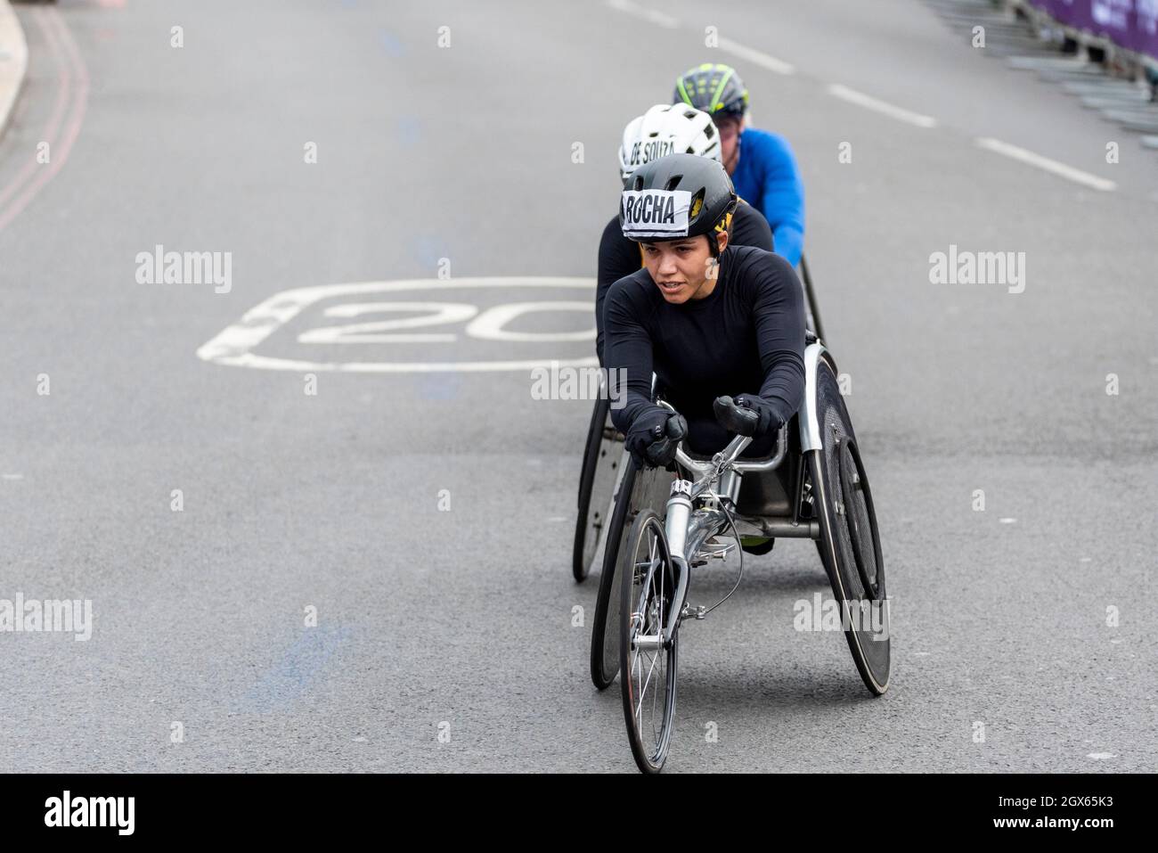 Aline Rocha racing in the Virgin Money London Marathon 2021 wheelchair race, in Tower Hill, London, UK. Wheelchair athlete Stock Photo