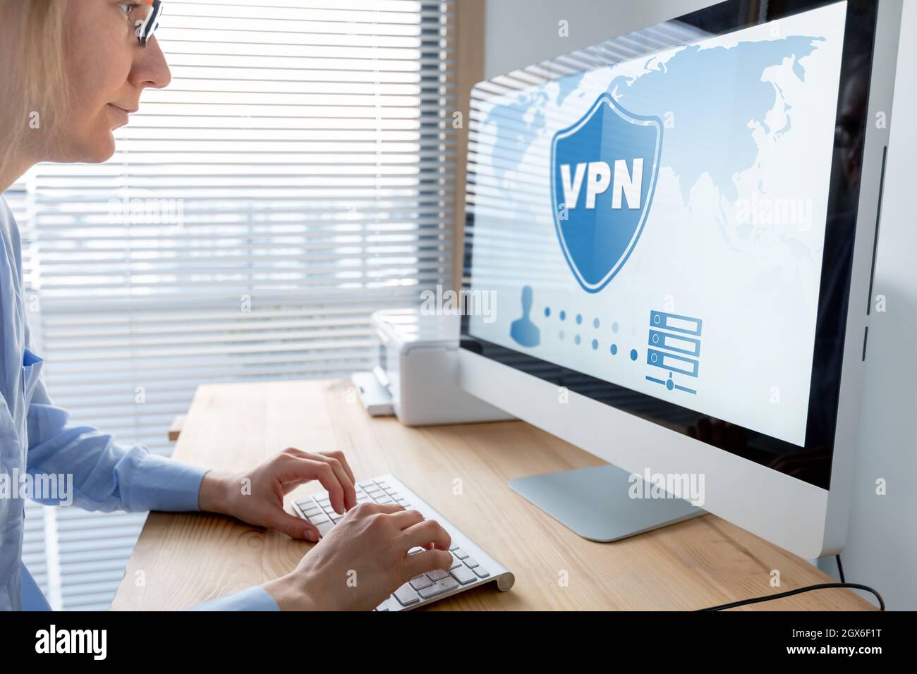 VPN secure connection for telecommuter. Person using Virtual Private Network technology on computer to create encrypted tunnel to remote server on int Stock Photo