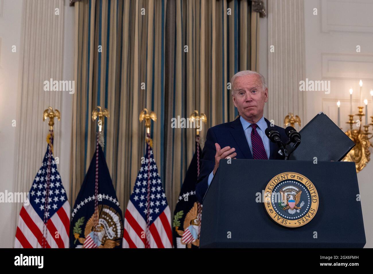 United States President Joe Biden delivers remarks in the State Dining Room of the White House in Washington, DC on Monday, October 4, 2021. The President spoke on the debt ceiling and infrastructure package being debated on Capitol Hill. Credit: Tasos Katopodis/Pool via CNP /MediaPunch Stock Photo