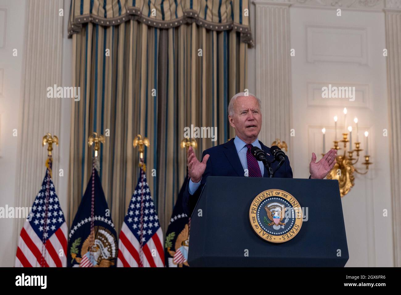 United States President Joe Biden delivers remarks in the State Dining Room of the White House in Washington, DC on Monday, October 4, 2021. The President spoke on the debt ceiling and infrastructure package being debated on Capitol Hill. Credit: Tasos Katopodis/Pool via CNP /MediaPunch Stock Photo