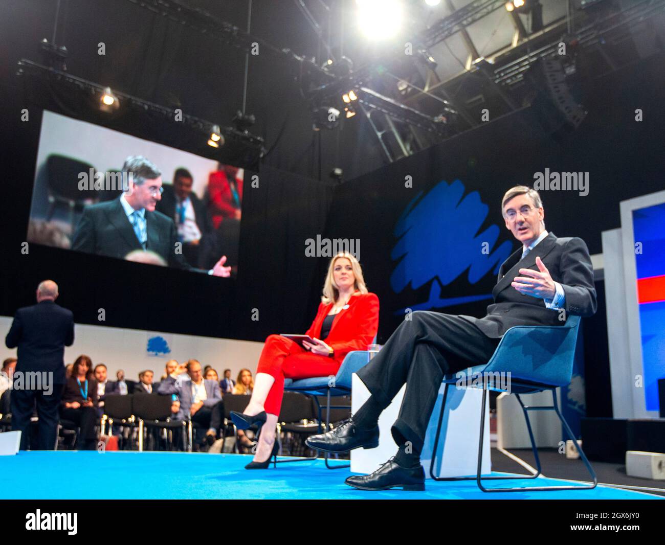 Manchester, UK. 4th Oct, 2021. Leader of the Commons, Jacob Rees-Mogg, chats at Conference. A lady outside the conference called him ‘Scum'. Credit: Mark Thomas/Alamy Live News Stock Photo