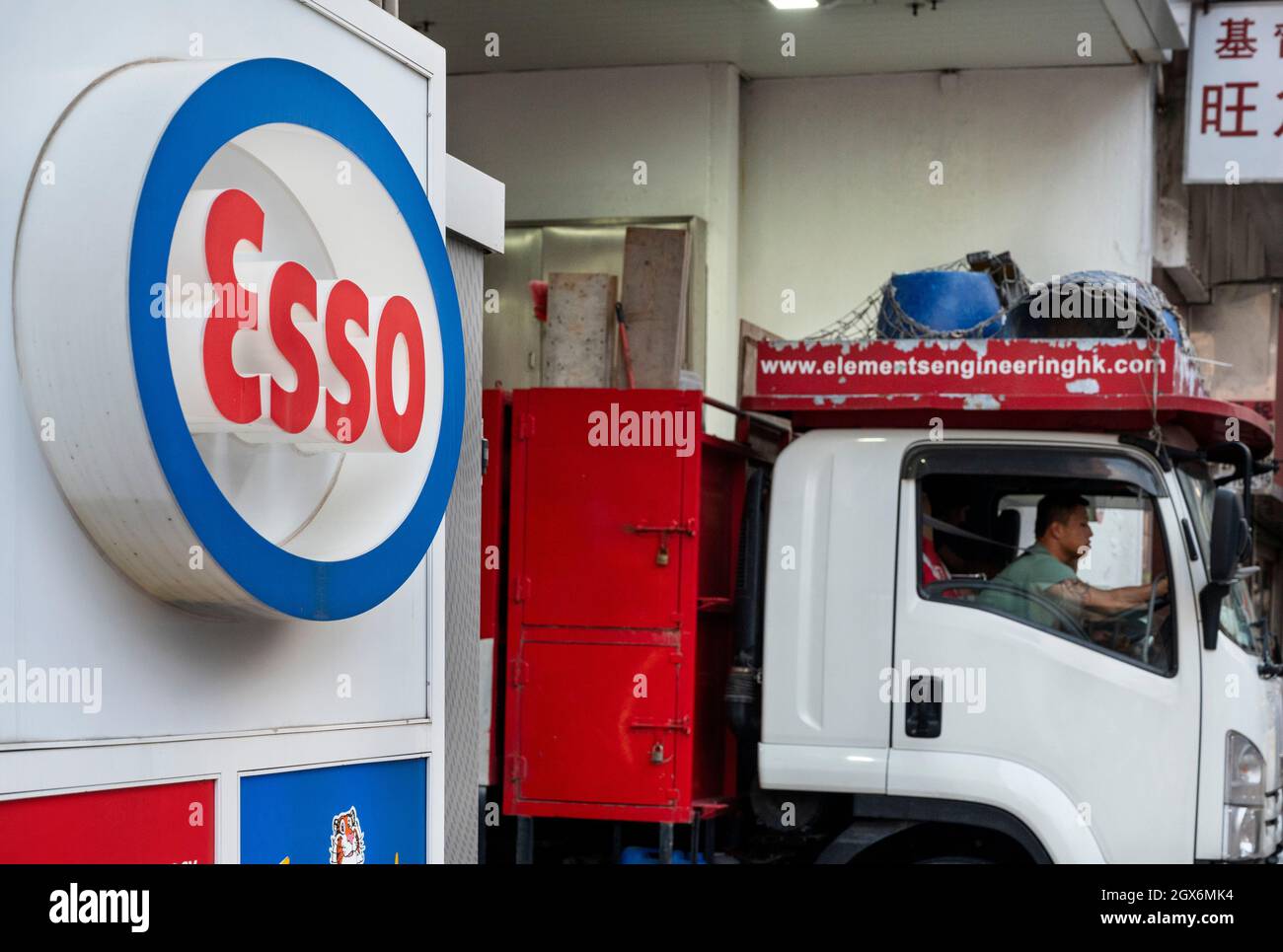 Hong Kong, China. 04th Oct, 2021. A customer leaves the American gas and oil station Esso, owned by ExxonMobil, seen in Hong Kong. (Photo by Budrul Chukrut/SOPA Images/Sipa USA) Credit: Sipa USA/Alamy Live News Stock Photo