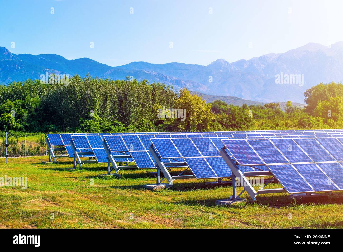 solar panels in field surrounded by mountains Stock Photo - Alamy