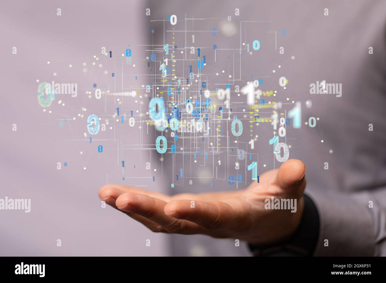A hologram of binary codes on the palm of a businessman - digital ...