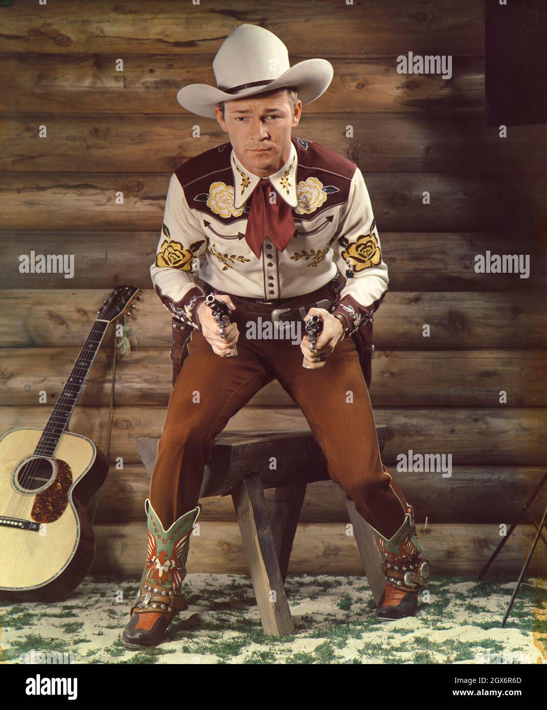 Roy Rogers (1911-1998), American Actor and Singer, full-length Portrait in Cowboy Outfit and Pistols, Harry Warnecke, Robert F. Cranston, 1942 Stock Photo