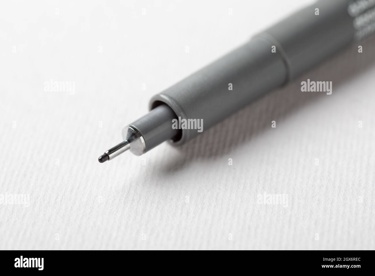 Close Up of a Pigment Liner on a White Sheet Stock Photo