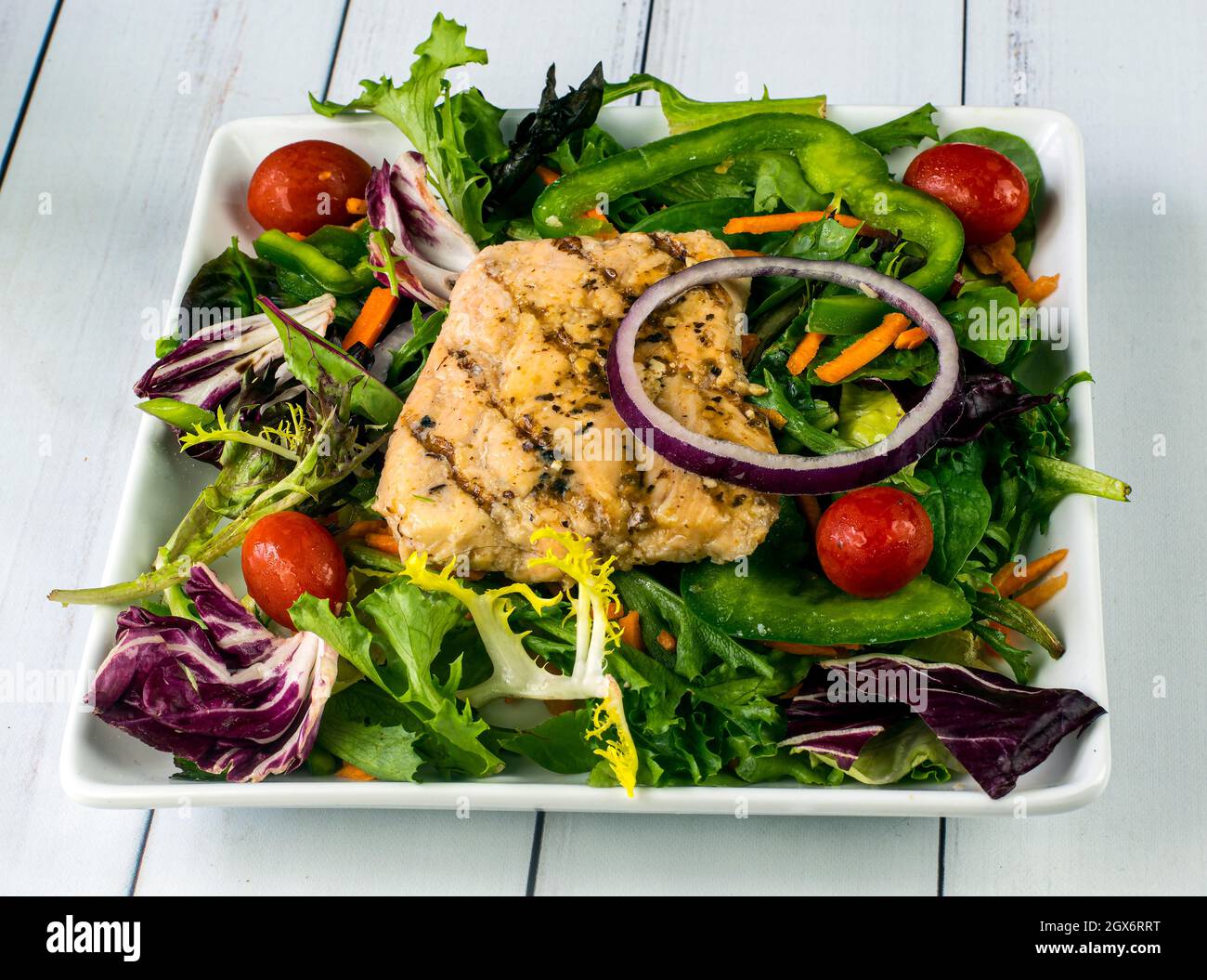 grilled salmon on a mixed green salad Stock Photo Alamy