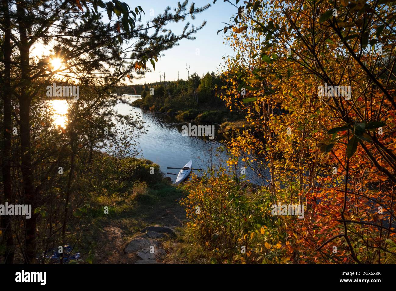 A kayak and autumn leaves at Iron Lake on the Gunflint Trail, northern Minnesota, USA Stock Photo