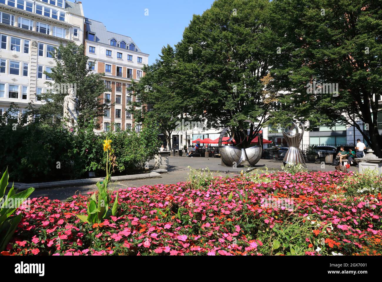 Golden Square in Soho, City of Westminster, an historical garden square surrounded by classical office buildings and with art installations, London UK Stock Photo