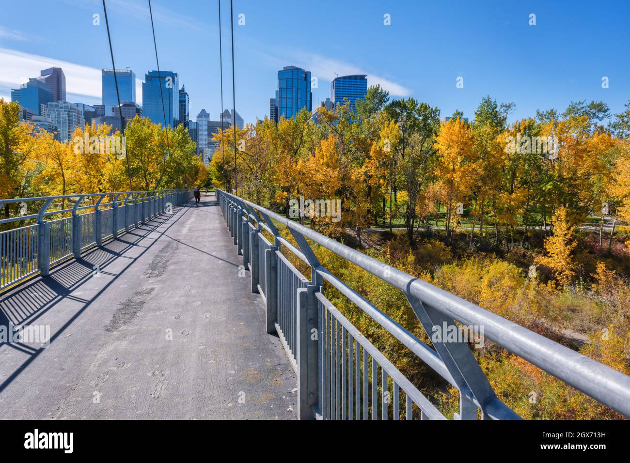 Calgary, Alberta, Canada - 27 September 2021:  Bow River Pathway between Sunnyside and Prince's Island, with Calgary skyline in background Stock Photo