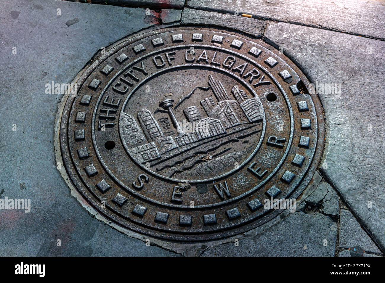 Calgary, Alberta, Canada - 27 September 2021:  All Calgary sights on a manhole cover Stock Photo