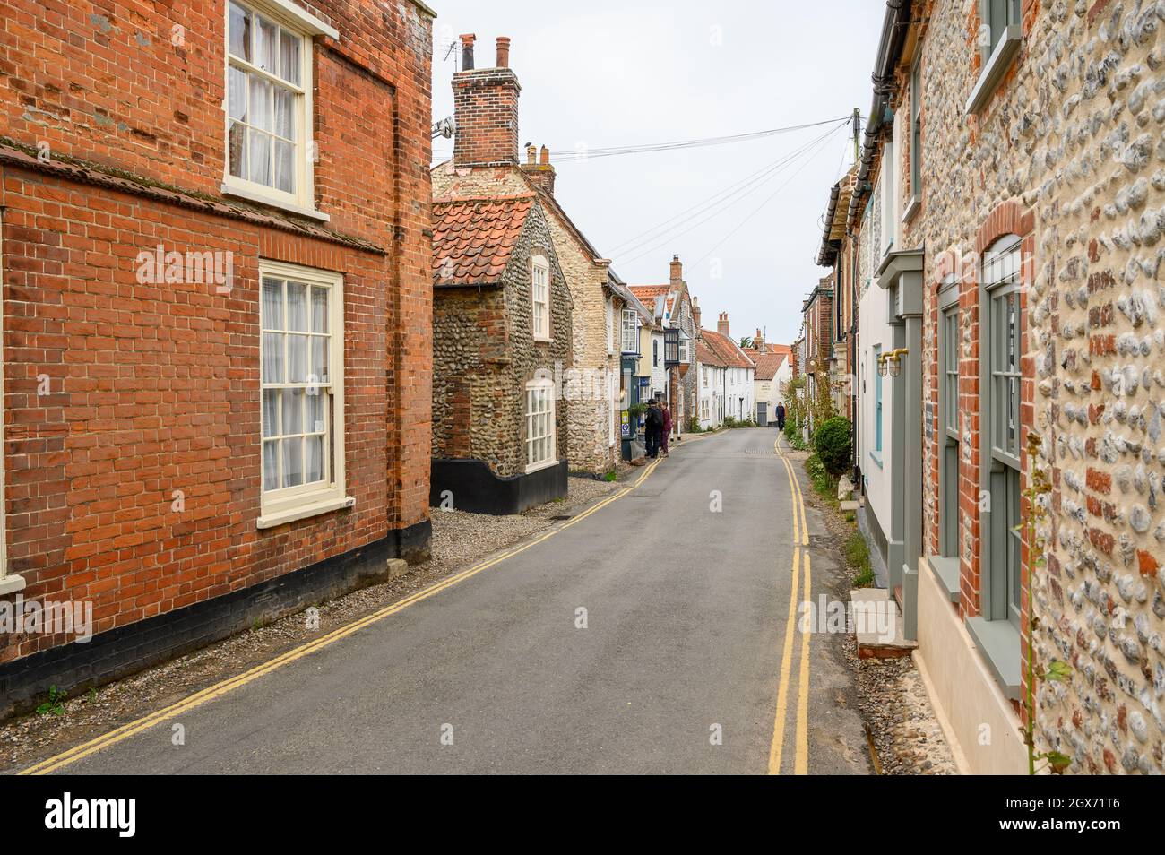 High Street in Blakeney village is a charming road with period houses with rendered brick or