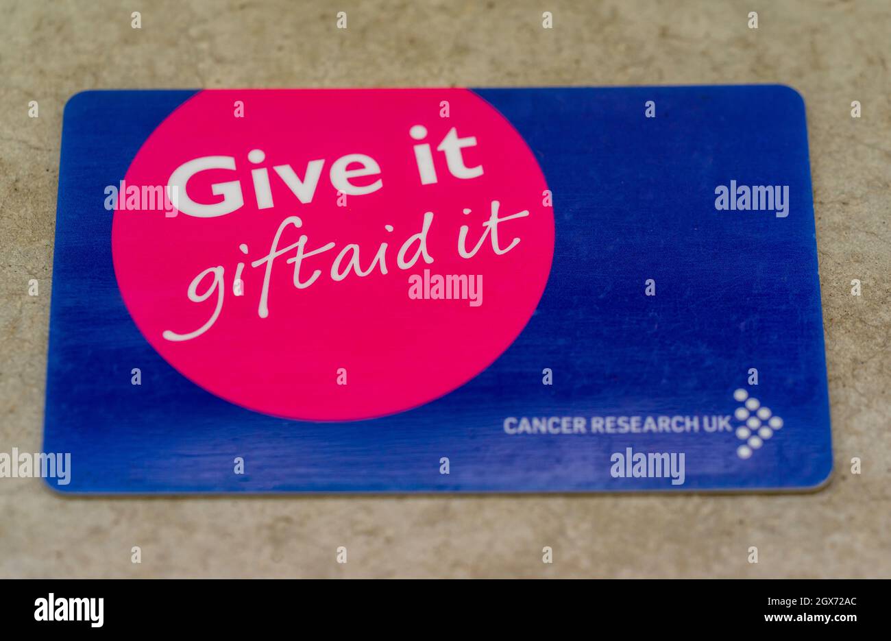 Gift Aid identification id card for Cancer Research UK Stock Photo