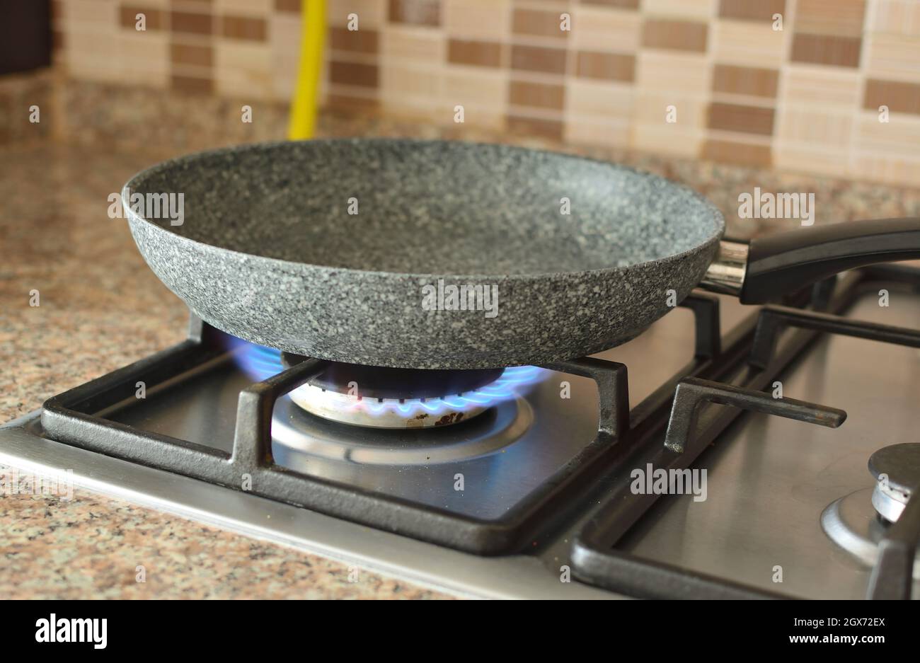 empty pan on the burning stove Stock Photo Alamy