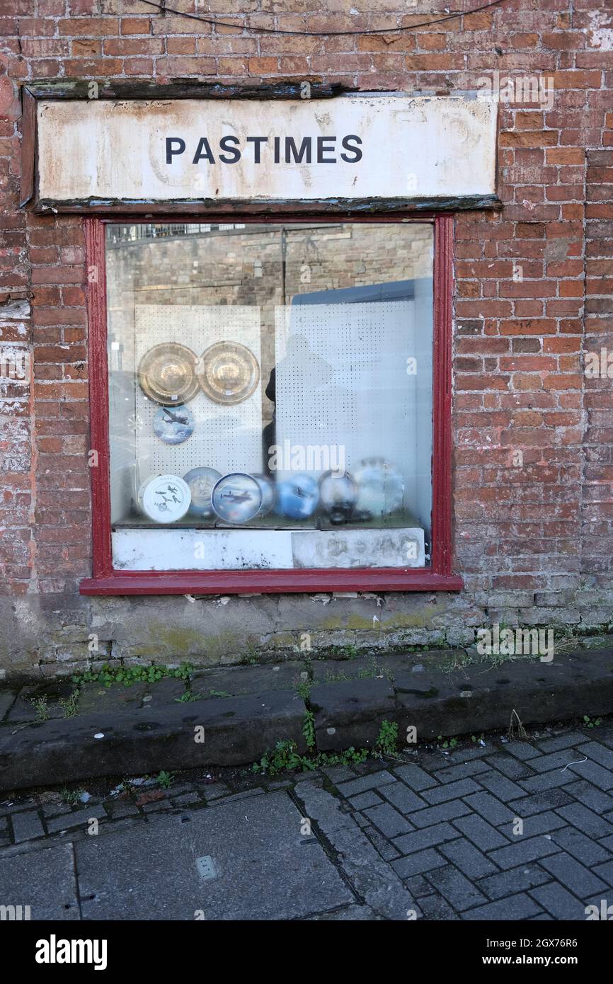 September 2021 - Pastimes, an old shop window selling used and antique goods in the city of Bristol, England, UK. Stock Photo