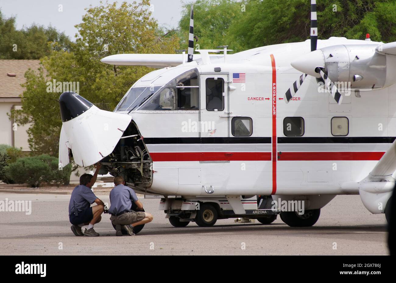 April 25, 2012. Arizona United States of America. Mechanics analyzing and repairing a Skyvan plane before the flight. Stock Photo