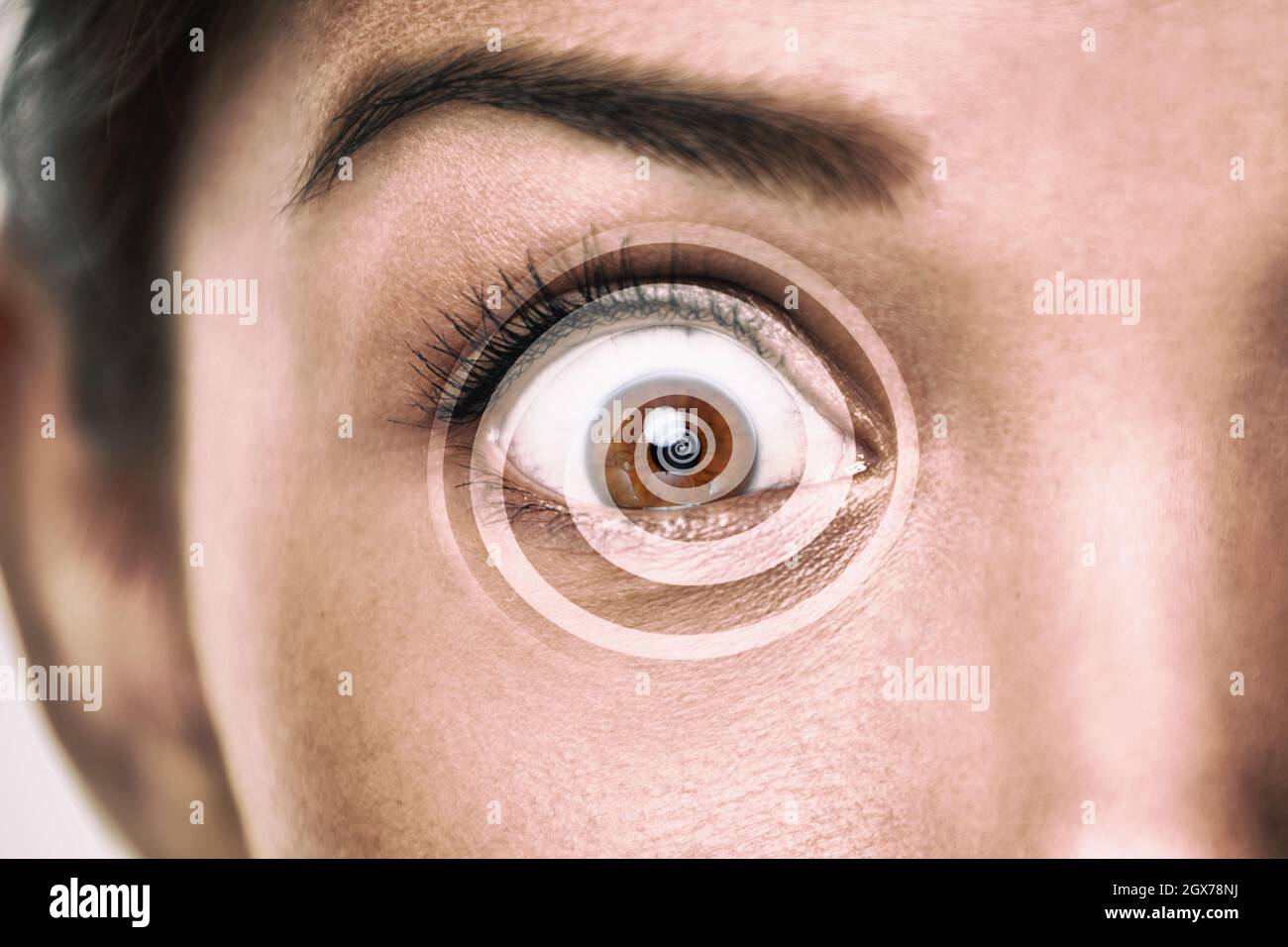 Hypnosis treatment eye with overlay of spiral for hypnose concept