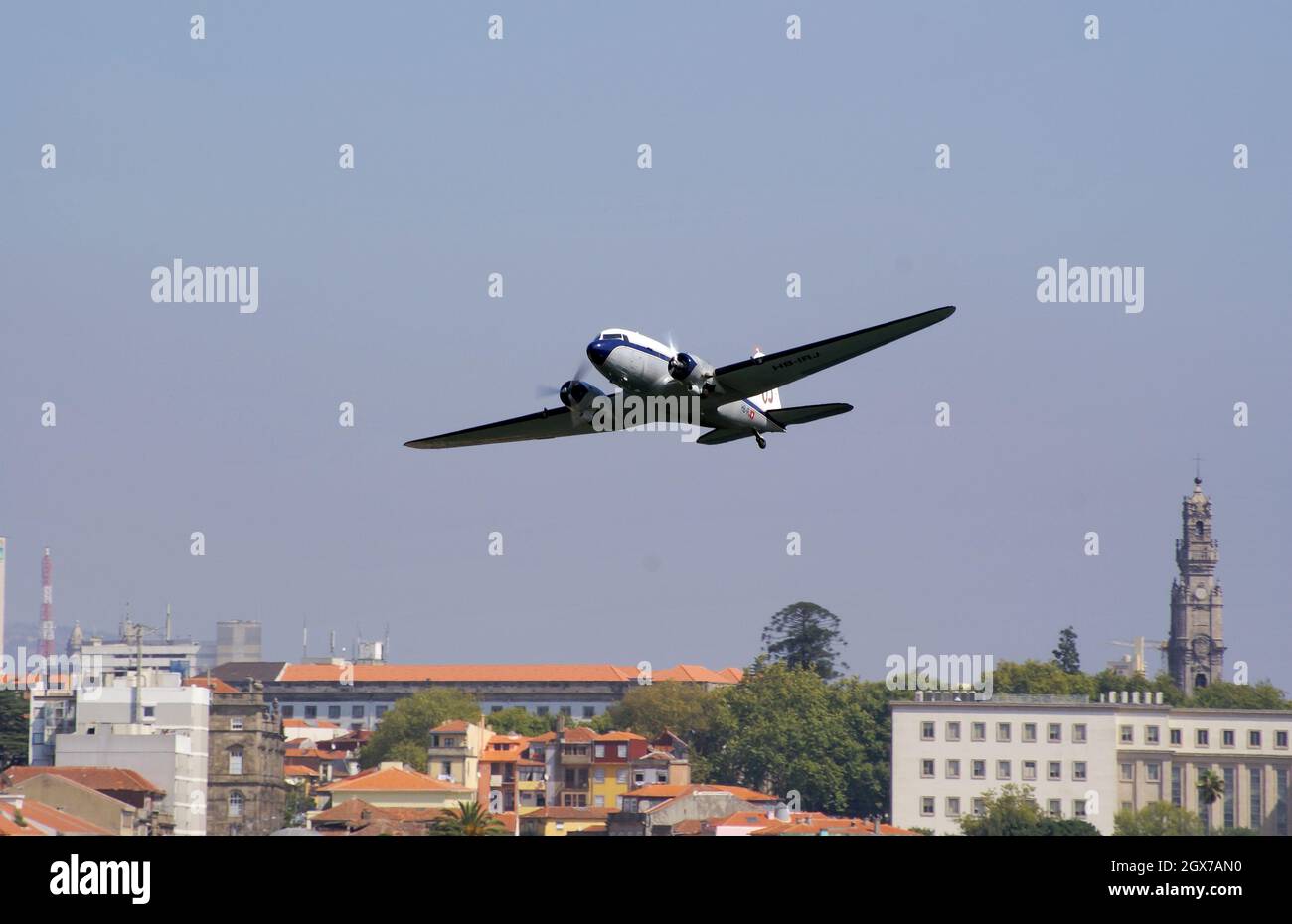 September 13, 2009. Porto, Portugal. Breitling Douglas DC-3 (HB-IRJ) passenger plane flying in the Red Bull air race. Stock Photo