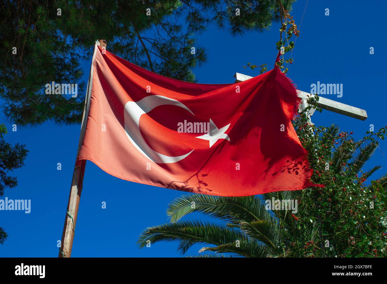 A deformed Turkish flag. Red base and white crescent. Stock Photo