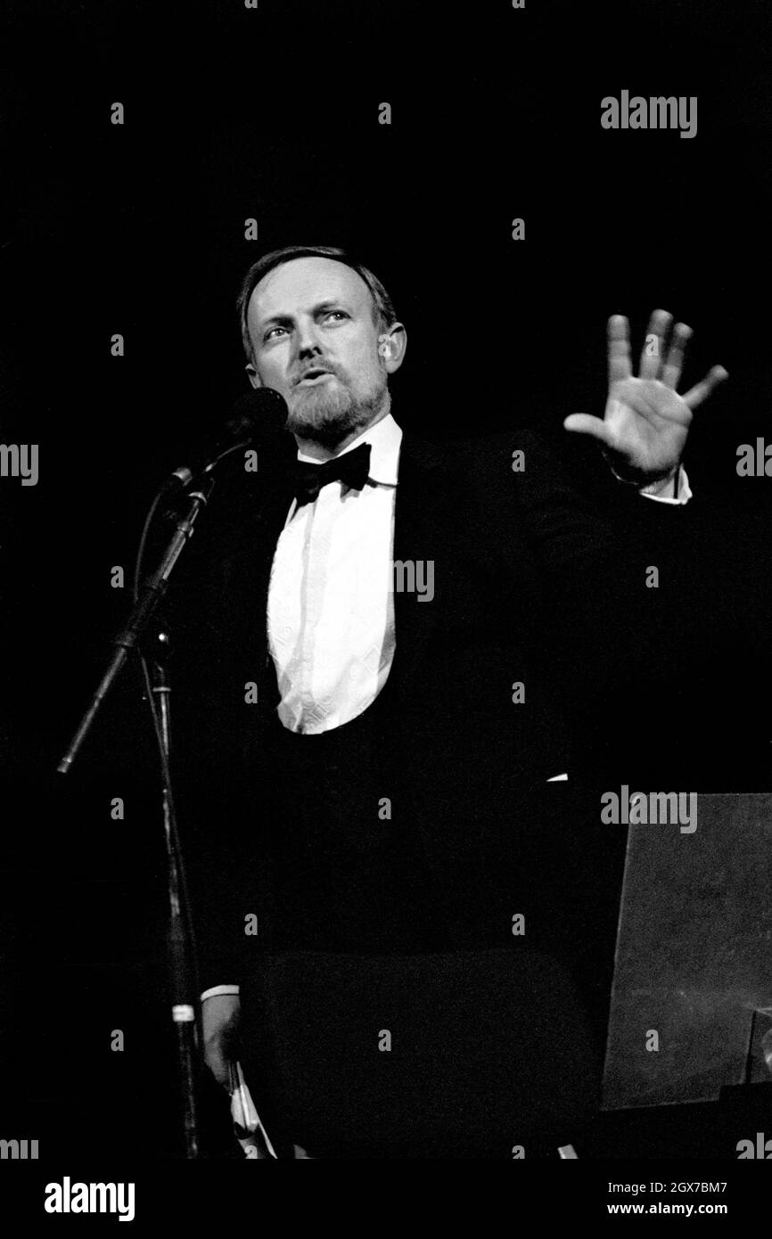 Richard Stilgoe, OBE, English songwriter, lyricist and musician, presenting the Schools Prom at the Royal Albert Hall, London, in 1987. Stock Photo