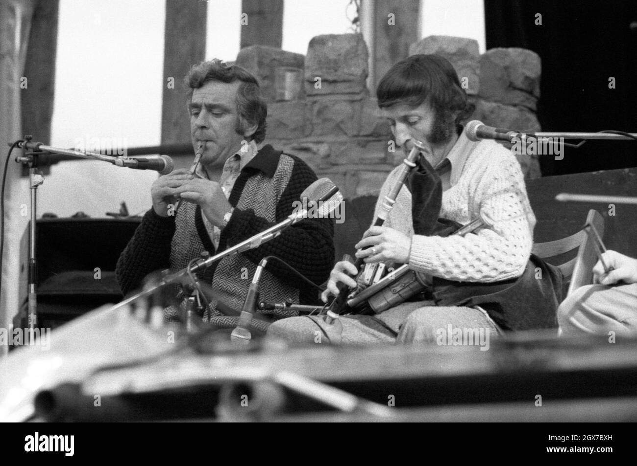 Seán Potts (left) and Paddy Moloney performing with The Chieftains at the July Wakes folk festival in Chorley, Lancashire, England on 25 July 1976. Stock Photo