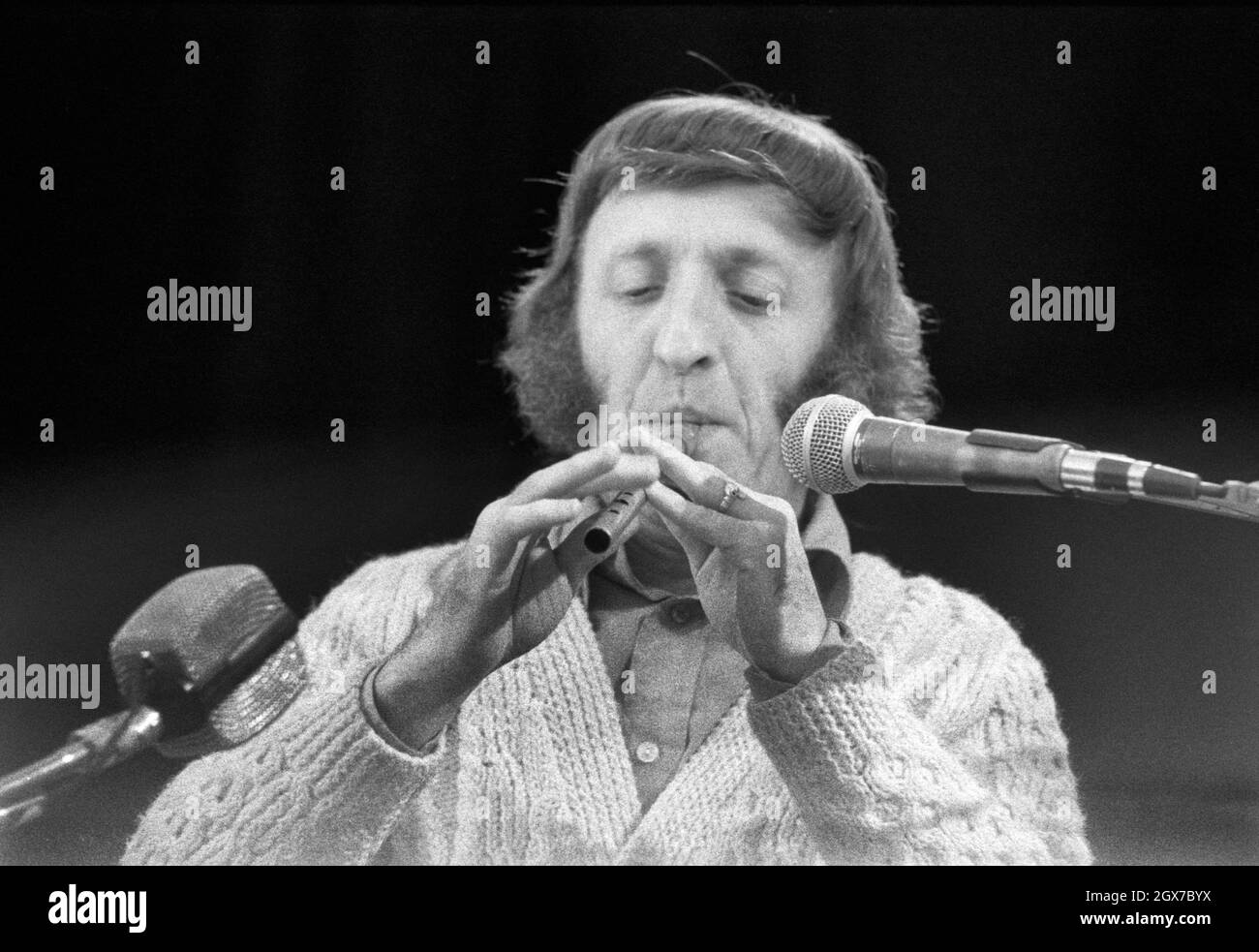 Irish musician and composer Paddy Moloney performing with The Chieftains at the July Wakes folk festival in Chorley, Lancashire, England on 25 July 1976. Stock Photo
